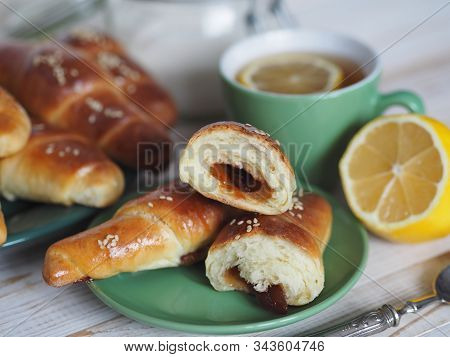 Ready-made Toasted Homemade Bagels On A Black Baking Sheet From The Oven. Ready To Eat. Sprinkled Wi