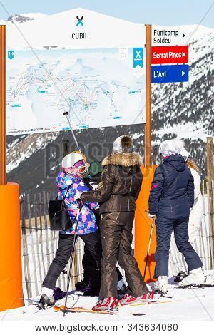 Pyrenees, Andorra - February 15, 2019: Unknown Tourists Are Looking At The Circuit On The Mountainsi