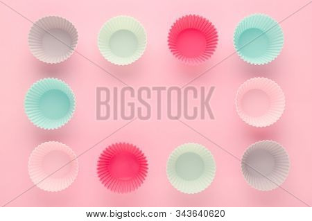 Silikone Forms For Baking Muffins And Cupcakes On Pastel Pink Background