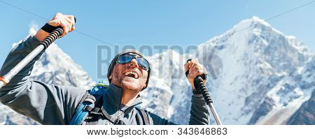 Portrait Of Smiling Hiker Man On Taboche 6495m And Cholatse 6440m Peaks Background With Trekking Pol