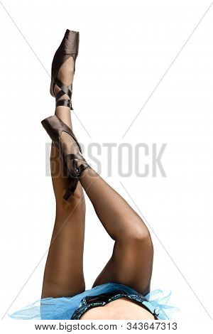Ballet Dancer Sexy Legs In Pointes Shoes With Laces. Posing With Straight And Crossed Legs. Vertical