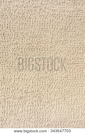 Background Texture Made Of Yellowish Abstract Ornament Of Sheetrock. Vertical Image