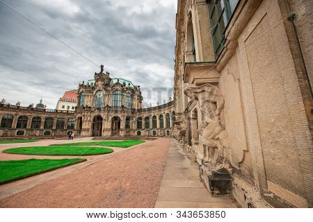 Dresden, Germany - May 27, 2019. Zwinger Palace In Dresden. In The Courtyard Are Planted Forms Of Gr