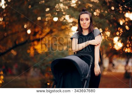 Woman Scratching Her Arm Fighting Mosquitoes In The Park