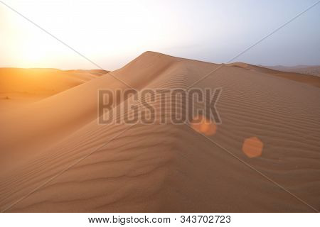 The Beauty Of The Sand Dunes In The Sahara Desert In Morocco. The Sahara Desert Is The Largest Hot D