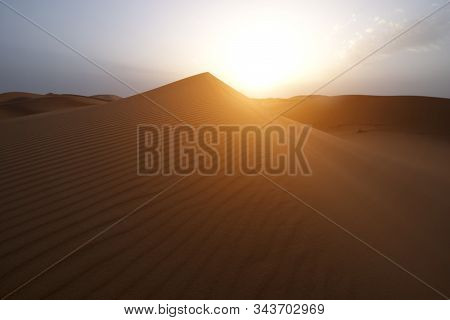The Beauty Of The Sand Dunes In The Sahara Desert In Morocco. The Sahara Desert Is The Largest Hot D