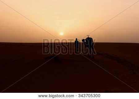 The Beauty Of The Sand Dunes In The Sahara Desert In Morocco. The Sahara Desert Is The Largest Hot D
