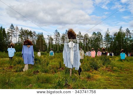 Suomussalmi, Finland - July 24, 2019: View To The Group Of Objects In People Clothes Which Looks Lik