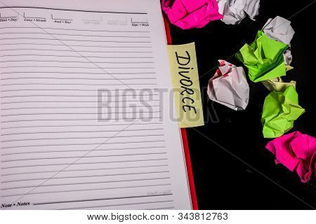 Office Desk With Agenda, Crumpled Paper And Label With Text Divorce. Isolated Photo. Bucharest, Roma