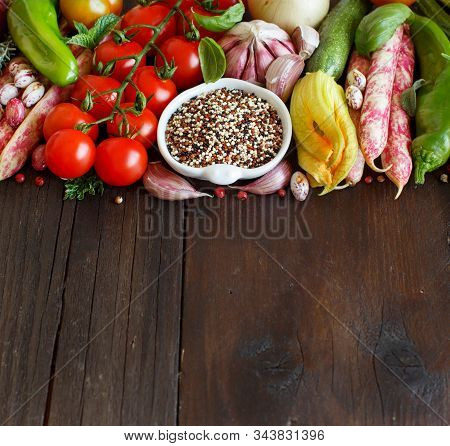 Uncooked Mixed Quinoa With Vegetables On Wood