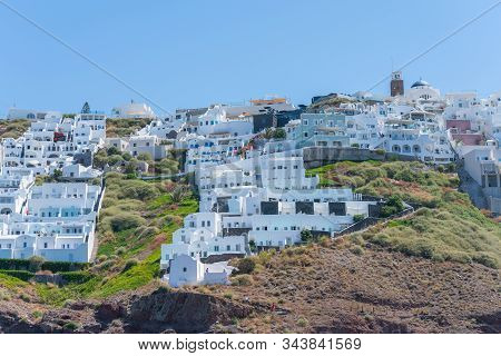 Santorini, Greece - August 10 2019; View Across To Characteristic White Architecture From Skaros Roc