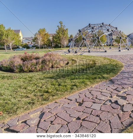 Square Frame Curved Path With Crazy Paving In A Park