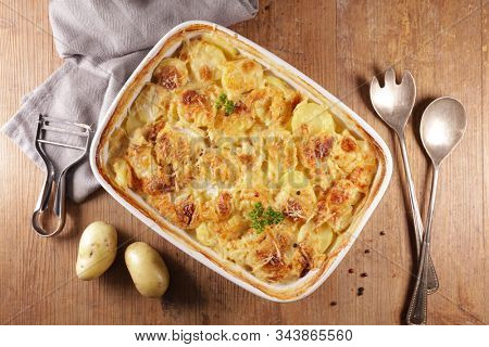 gratin dauphinois, baked potato with cream and cheese