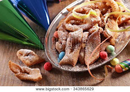 traditional french bugne, donut for carnival with confetti