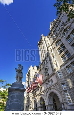 Washington Dc, United States - May 6, 2019 Benjamin Franklin Statue American Flags Old Post Office B