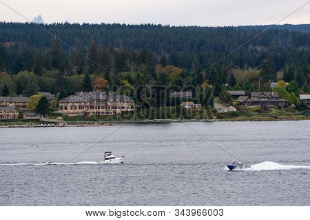 Campbell River, Vancouver Island, British Columbia, Canada. View Of Fishing Boat With Residential Ho
