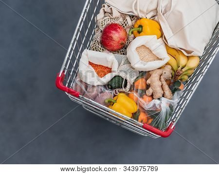 Fruit, Vegetables And Grains In Reusable Textile Fabric Bags Pouch In Shopping Cart. Top View Or Fla