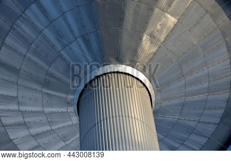 Metal Tower Of Reservoir Clad With Sheet Metal Aluminum Cladding. Rivets And Corrugated Sheets Resem