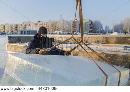 Portrait Of A Worker In A Black Hat Unloading