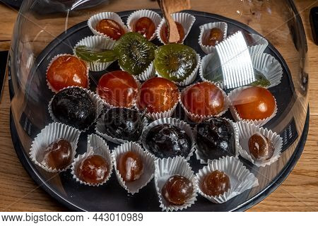 Close Up Of Mixed Dried And Caramelized Fruits On The Shop. High Quality Photo