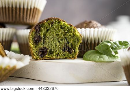 Spinach Muffins. Half Of A Green Muffin With Fresh Spinach Leaves. Home Bakings