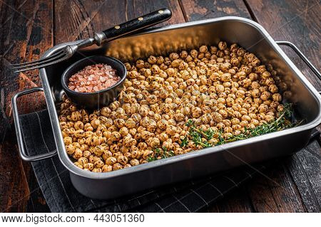 Vegetarin Snack Fried Chickpeas In A Kitchen Tray. Wooden Background. Top View