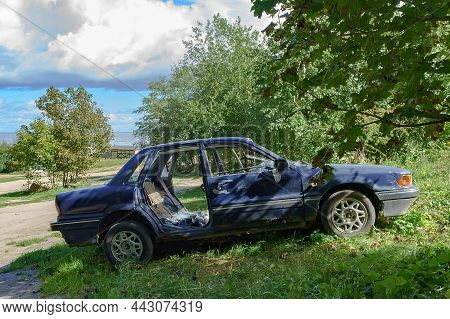 Kaliningrad Region, Russia, September 4, 2021. Wrecked Old Car. Abandoned Car. Stolen Car. Mitsubish