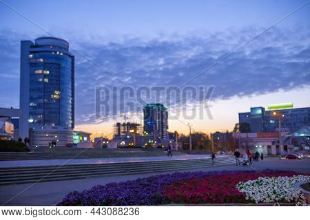 Modern Buildings In A Big City, Tall Houses Tower. Evening Outdoor, Road And Foreground Empty For Co