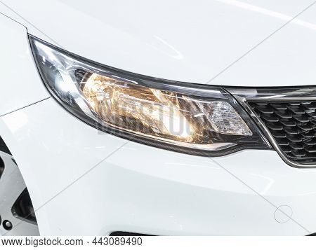 Novosibirsk, Russia - November 18, 2021:  Kia Rio, Glowing Headlight Of A Modern Car Close-up
