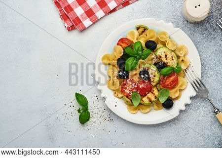 Pasta Fiocchi Salad With Vegetables Grilled Zucchini, Cherry Tomato, Olives, Basil And Parmesan Chee