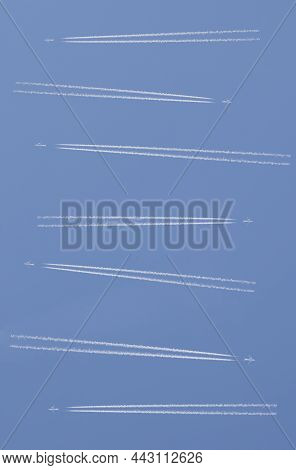 Aircrafts With Two Engines Crossing Over Blue Cloudy Sky. Congested Airspace Concept