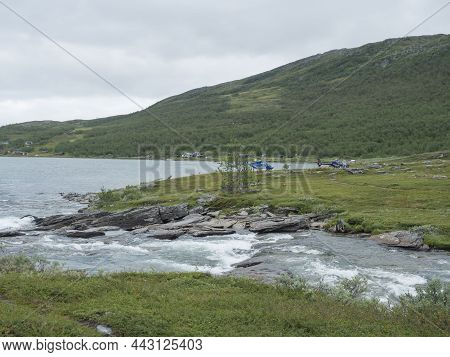 Staloluokta, Norrbotten, Sweden, Agust 11, 2021: Two Fiskeflyg Helicopters With Tourist And Supplies
