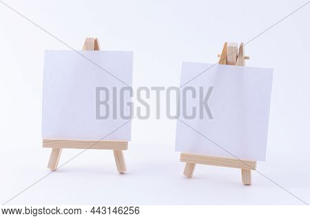 Two Wooden Easels Miniature With Blank White Square Canvas For Artists And Painters - Mockup. Mini W