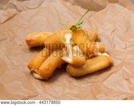 Tatsy Cheese Sticks With Deep-fried Mozzarella On Craft Paper
