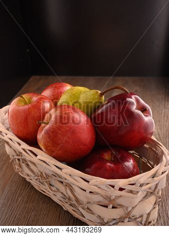 Photo Shows Several Apples And One Pear. Photo Was Taken In Studio Using Special Light. Red Apple Gl