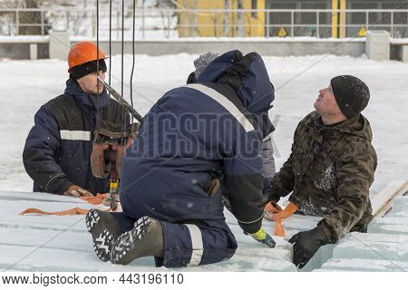 Installers Unloading Ice Blocks For An Ice Town