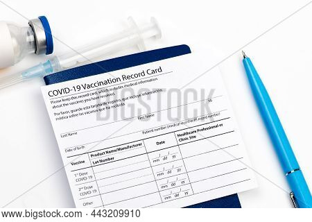 Covid-19 Vaccine Vial, Vaccination Record Card, Syringe, A Pen  Coronavirus Vaccination Concept. - I
