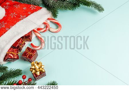 Christmas Or Winter Composition. Pine Cones And Red Berries On Pastel Blue Background. Christmas, Wi