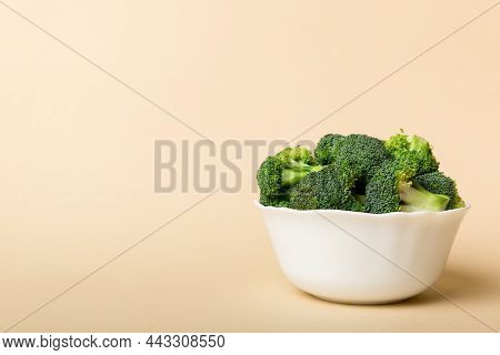 Broccoli Of Fresh Green Broccoli In Bowl Over Coloredbackground. , Close Up. Fresh Vegetable.