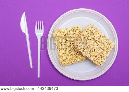Uncooked Instant Noodles On White Plate. Raw Pasta. Dry Asian Fast Food. Quick Lunch