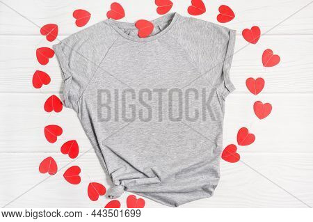Mockup White T Shirt With Paper Red Hearts. Happy Valentines Day Apparel Flatlay On White Wood Backg