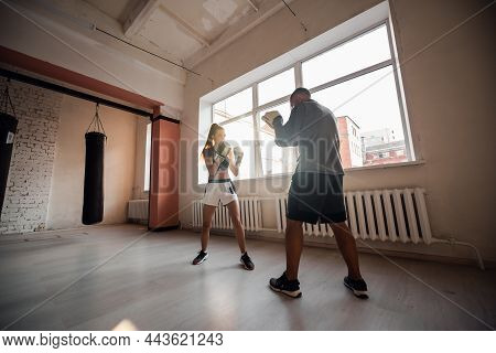 Female Martial Arts Fighter Practicing With Trainer, Punching Taekwondo Kick Pad Exercise Kicking. T