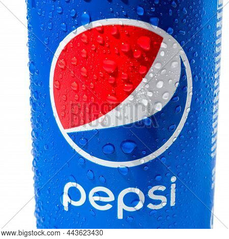 On A White Background, A Blue Can Or Glass With Drops Of Water, Pepsi Logo And Inscription. Close-up