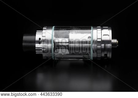 Vape. Tank From An Electronic Cigarette On A Black Background. Electronic Cigarette