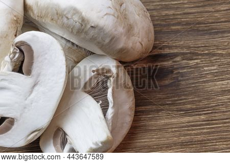 Food Background. Sliced Champignon Mushroom Close-up. Low-calorie Product, A Source Of Vitamin B1, B