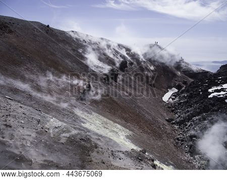 Silhouette Of Men Hiking At Caldera Of Avachinsky Stratovolcano, Also Known As Avacha Volcano. Backp