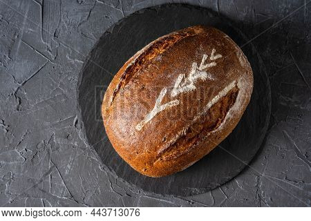 Freshly Baked Warm Delicious Rye Round Bread Close-up. Homemade Bread. The Concept Of Healthy Eating