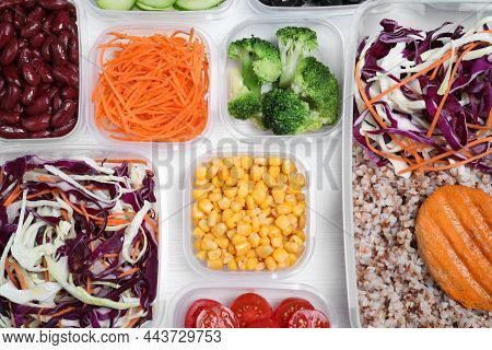 Set Of Plastic Containers With Fresh Food On White Wooden Table, Flat Lay