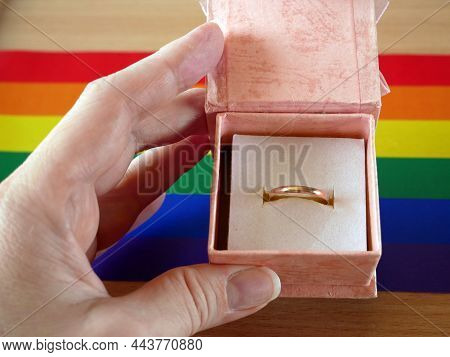 Old Wedding Ring In Gify Box On Rainbow Lgbt Flag And European Union Flag. Homosexual Marriage. Same