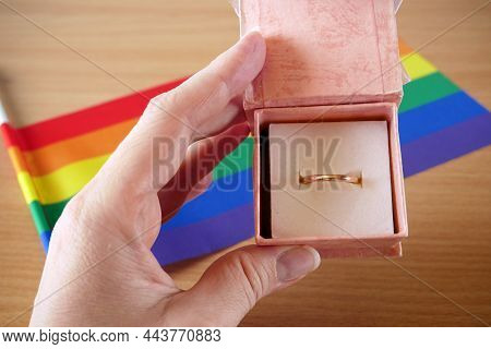 Old Wedding Ring In Gify Box On Rainbow Lgbt Flag And European Union Flag. Homosexual Marriage. Same